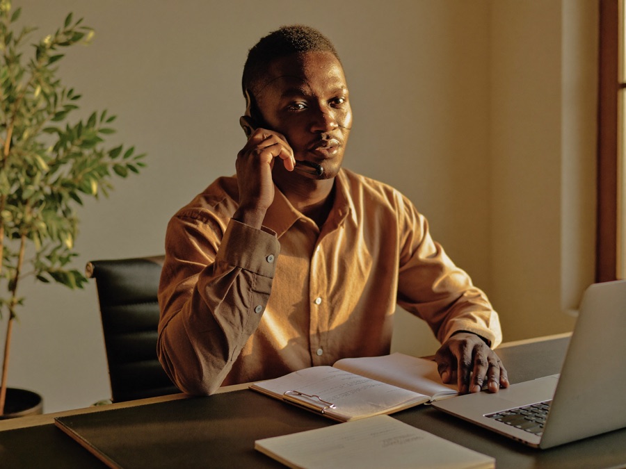 An appointment setter on an outbound call wearing a headset
